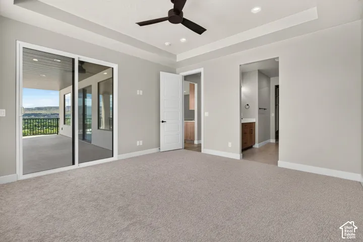 Tray ceiling with recessed lighting and a ceiling fan