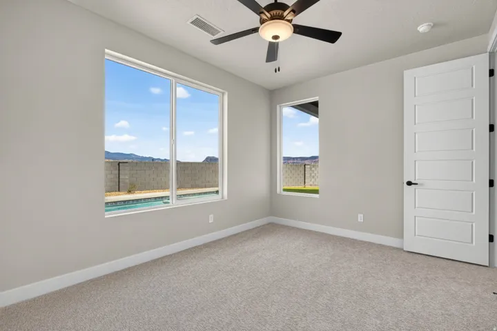 Recessed lighting, ceiling fan with integrated lighting, large window, additional window, modern paneled door