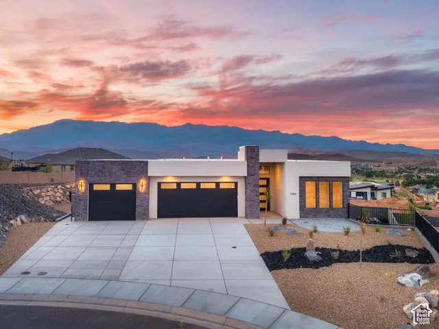 Contemporary exterior with stone accent walls and a smooth stucco finish