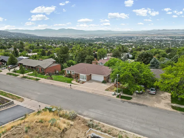 Suburban neighborhood setting with a distant mountain backdrop