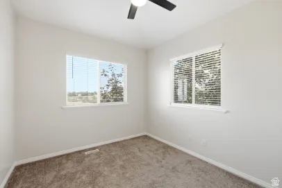 Neutral wall tones with soft carpet flooring