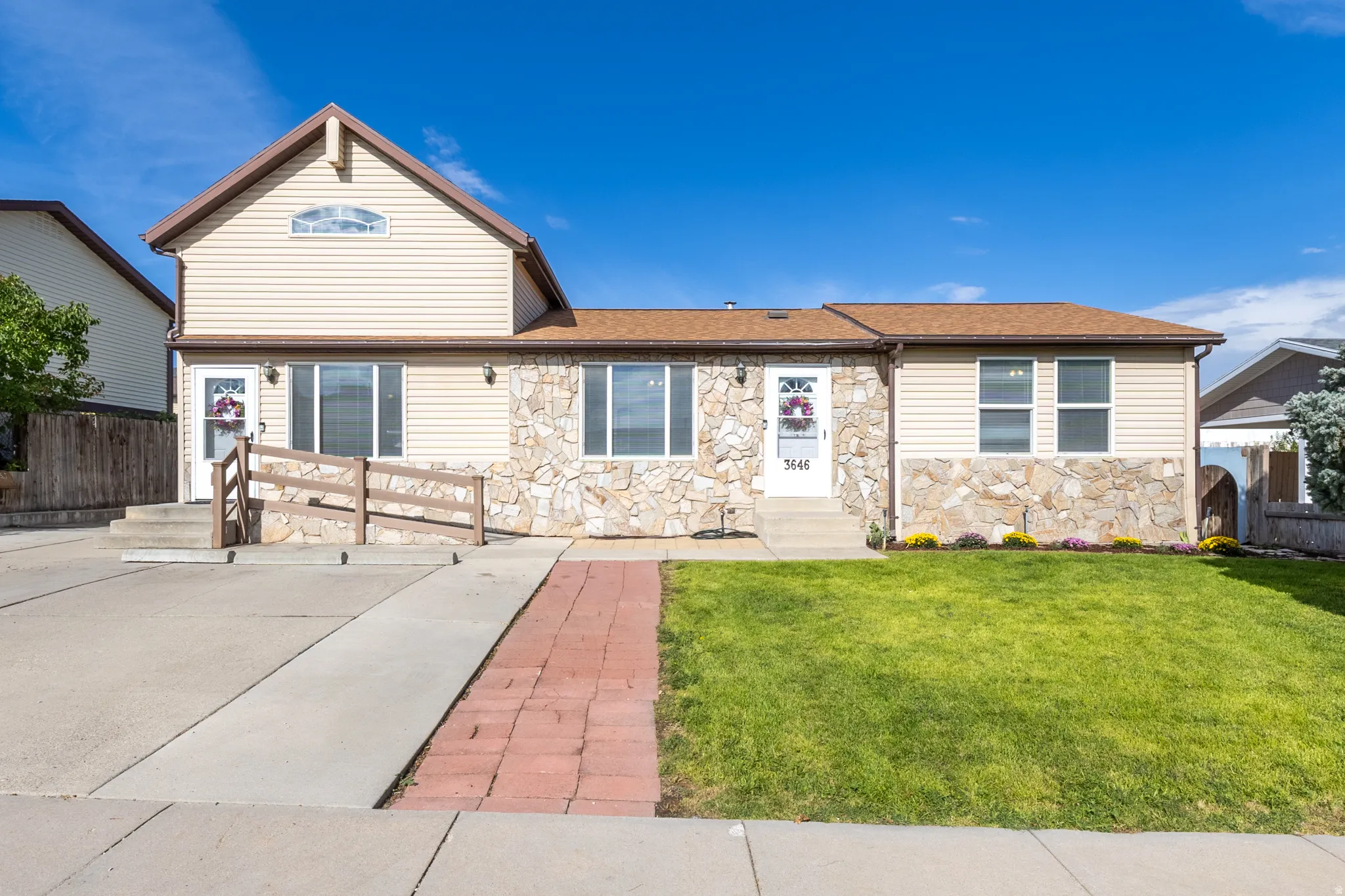 Exterior featuring stone veneer and horizontal siding