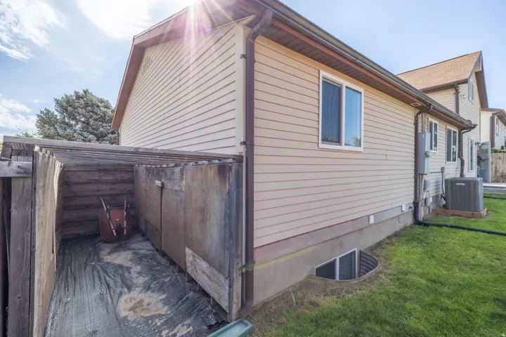 Beige horizontal siding exterior with brown trim and gabled roof