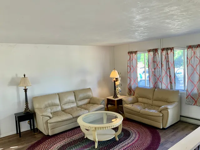 Wood-finish flooring with white walls and trim