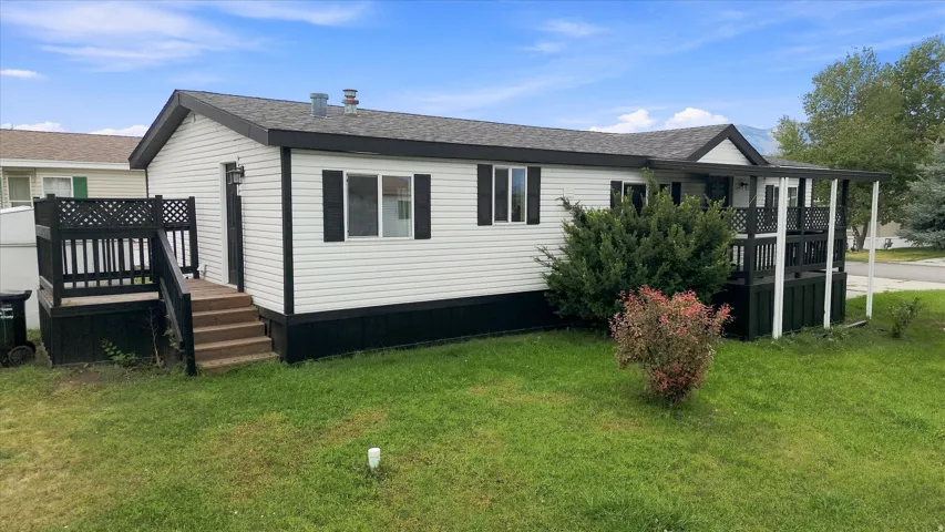 White siding exterior with dark trim