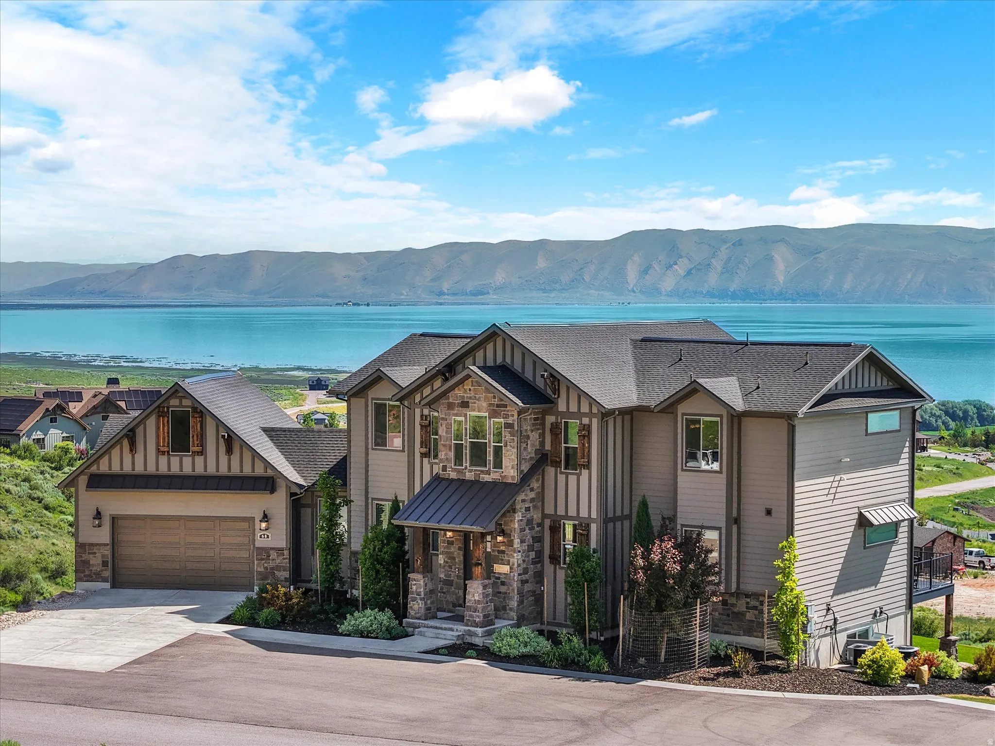 Craftsman-style exterior with stone and siding accents