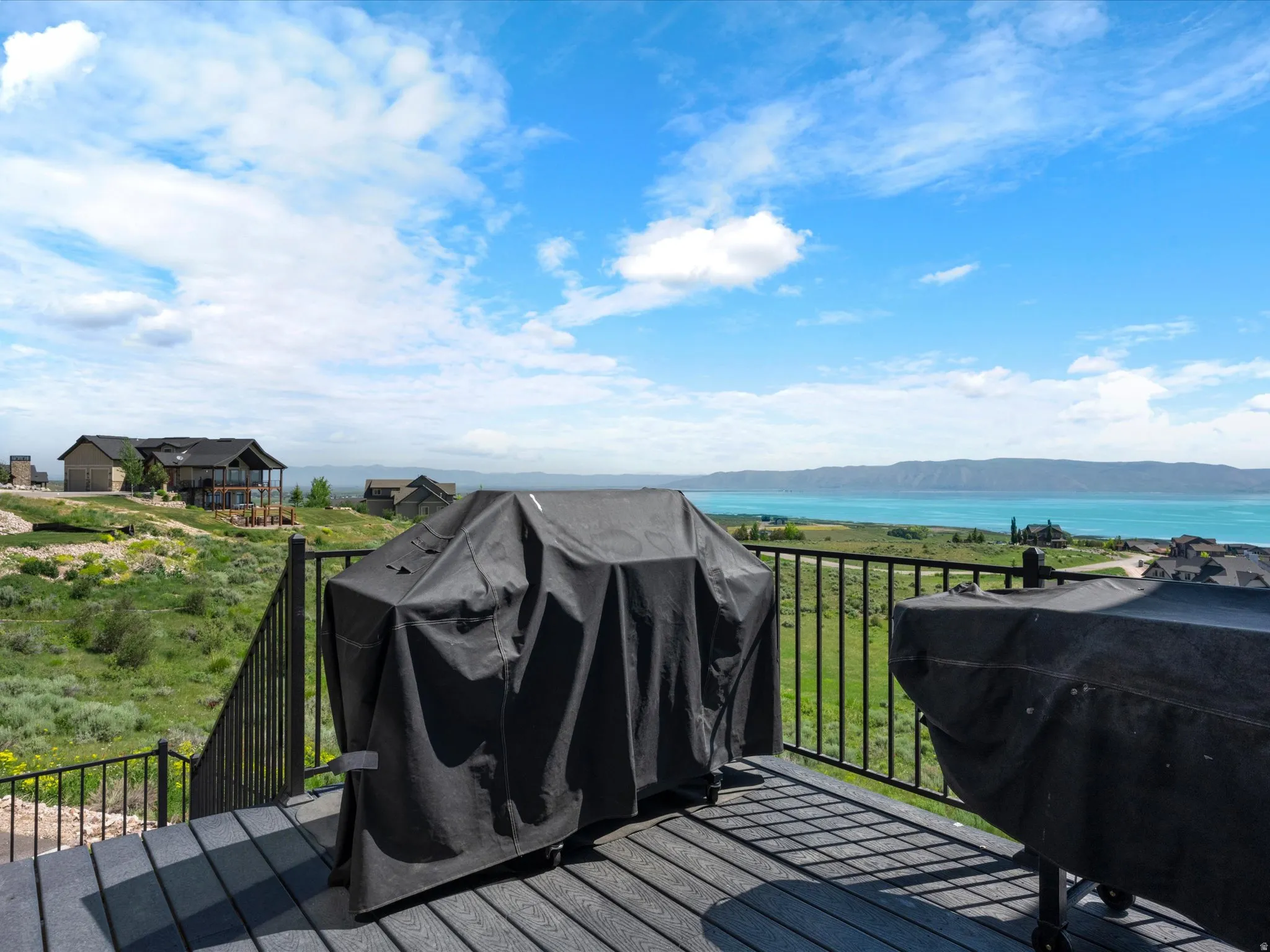 Expansive outdoor deck with composite decking and metal railing