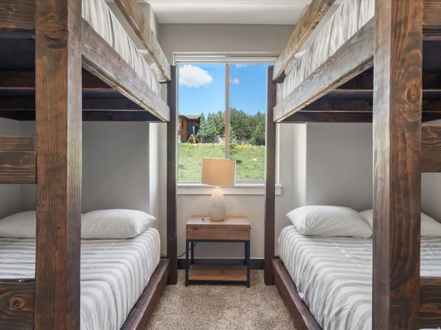 Built-in bunk beds with rich wood-finish frames