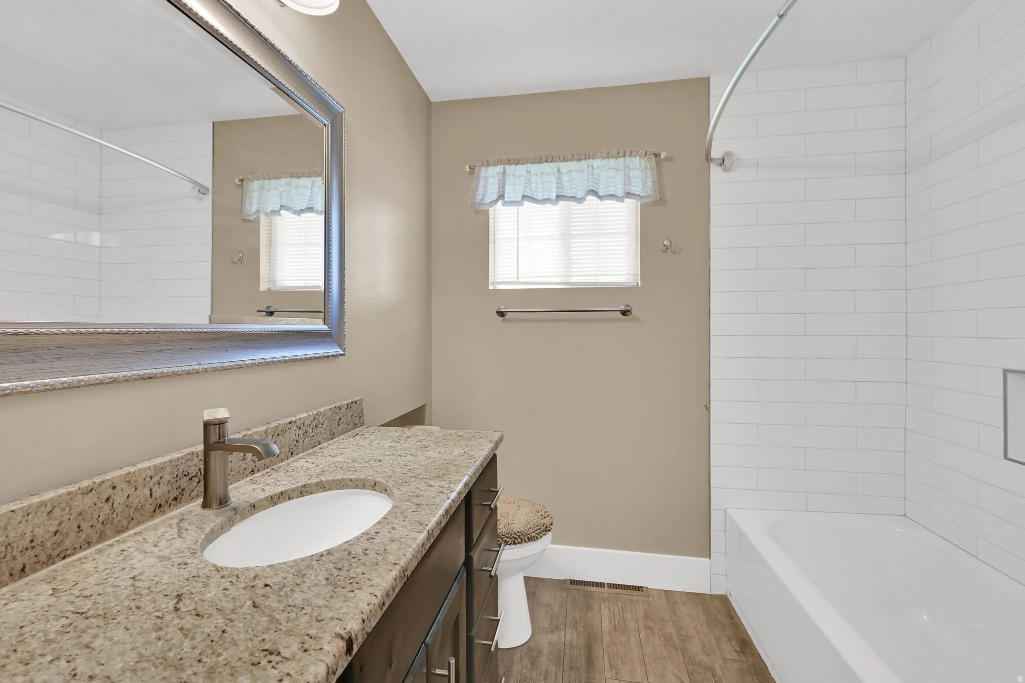 Say hello to your bathroom remodel, complete with granite countertops, new fixtures and tile flooring