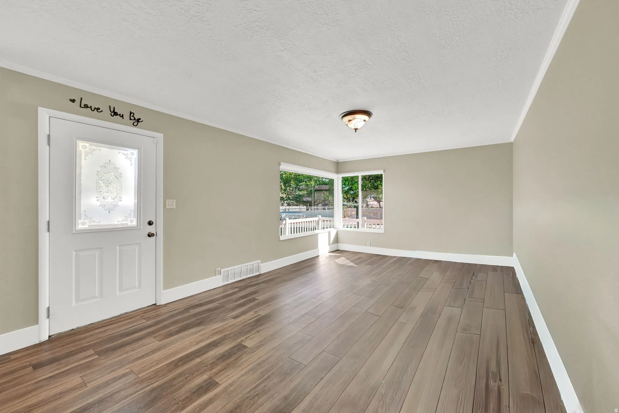 The inviting entry flows effortlessly from the front door into the main living area
