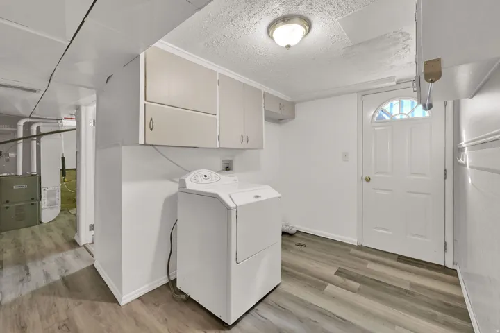 Designated Laundry Area with basement entrance. Dryer is included!