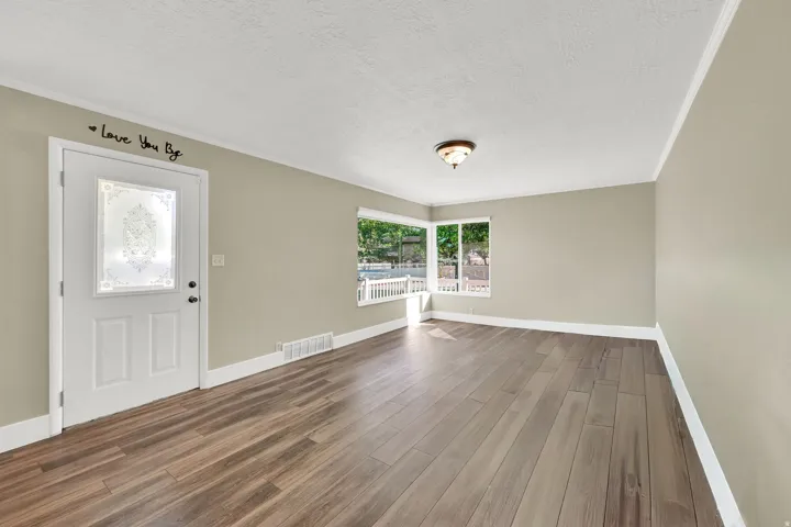The inviting entry flows effortlessly from the front door into the main living area