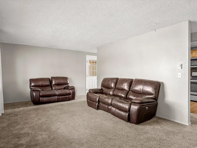 Wall-to-wall carpeting and neutral wall paint