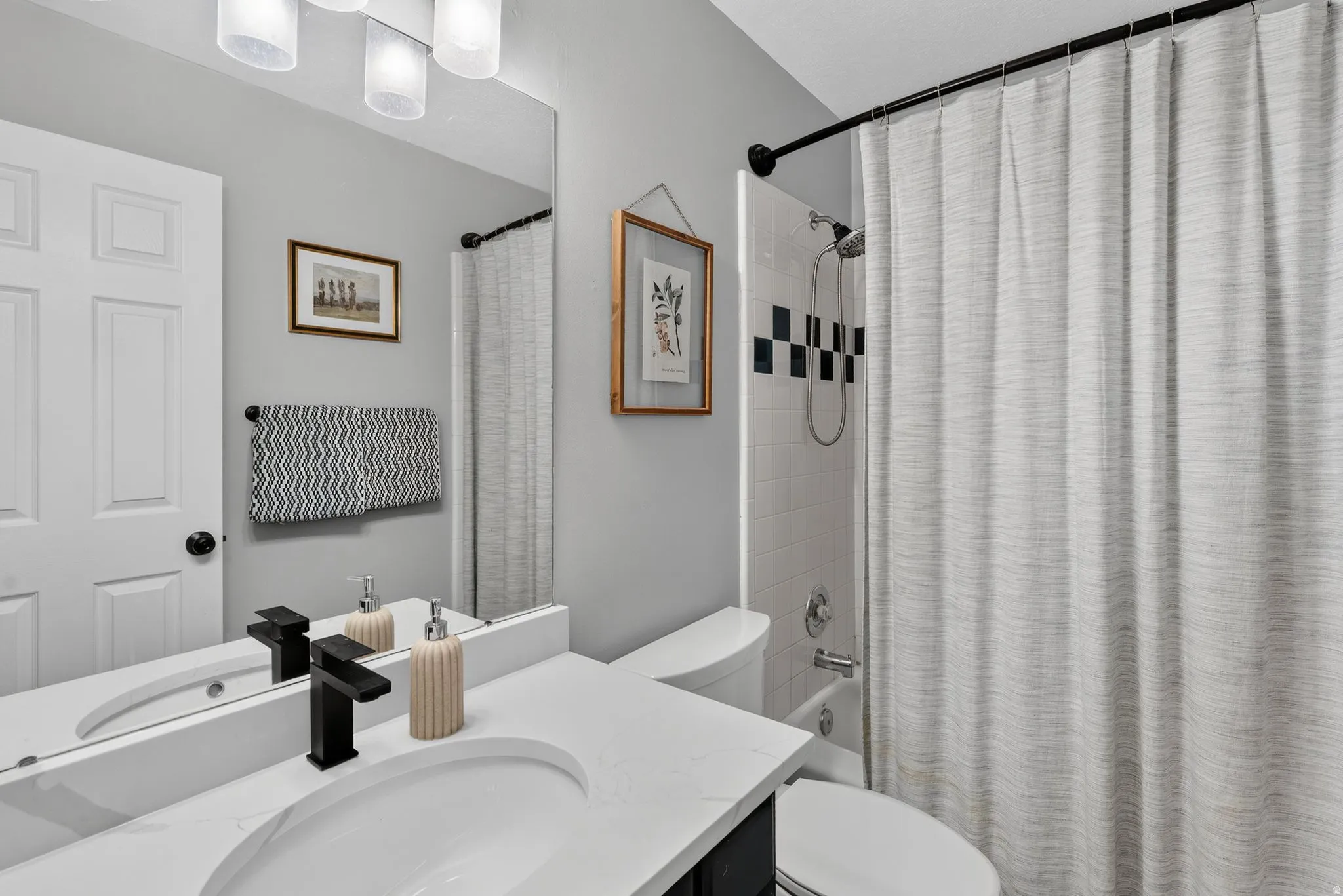 Guest Bath with Quarrtz countertop, tile shower and tile floor