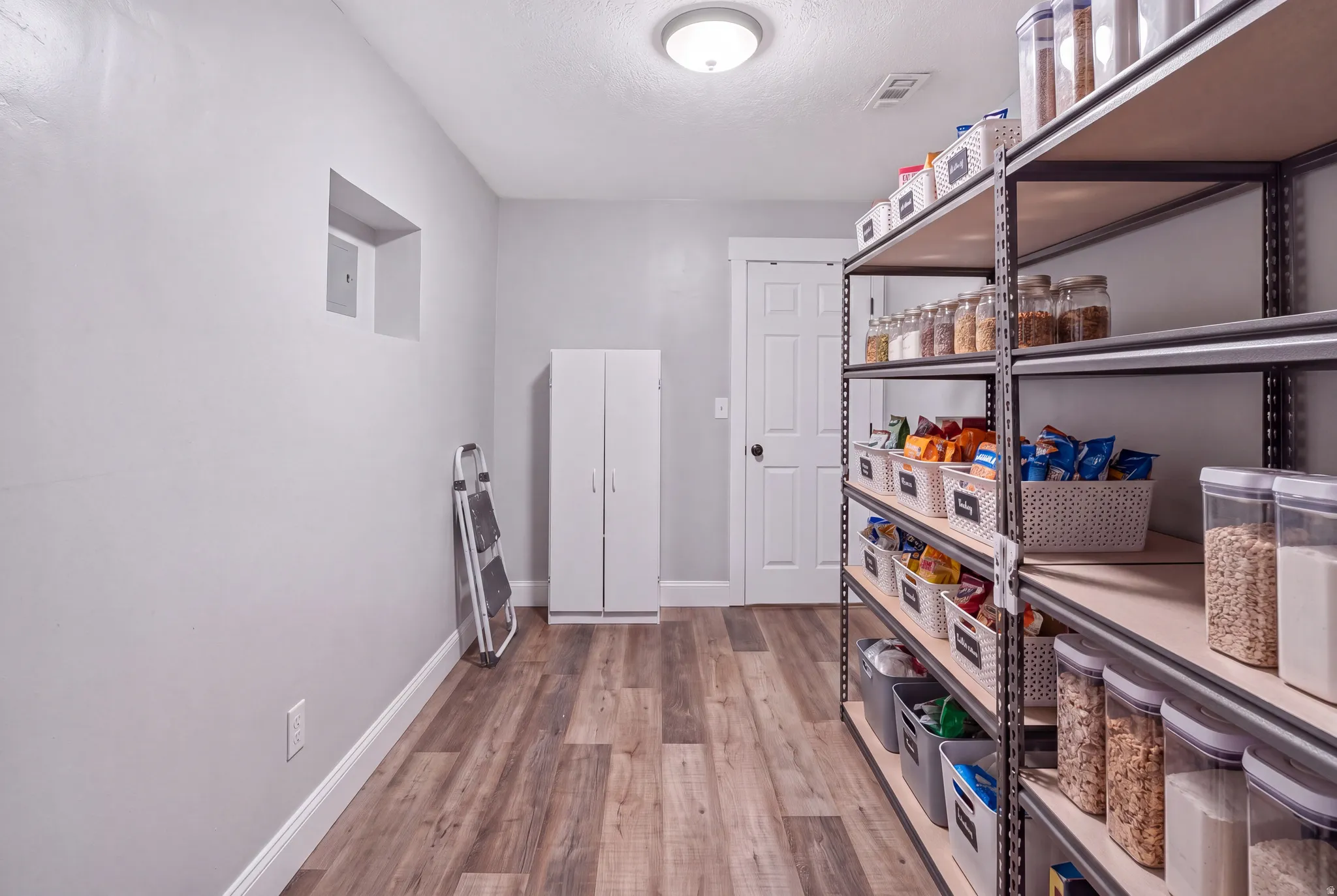 Large Walk in Pantry off the Living Room