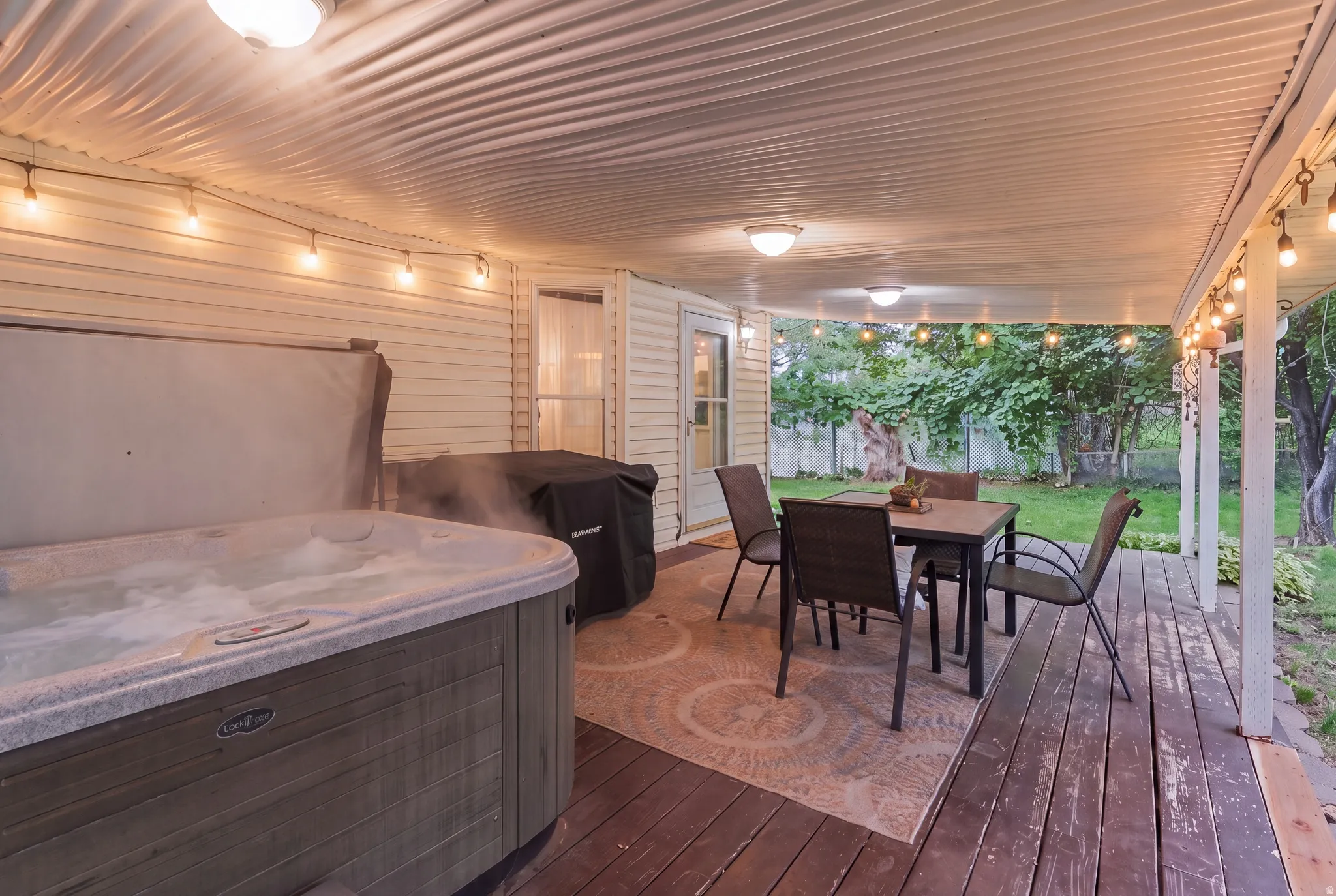 Cover Deck, decorative lighting and an INCLUDED HOT TUB
