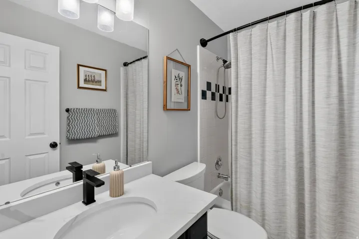 Guest Bath with Quarrtz countertop, tile shower and tile floor