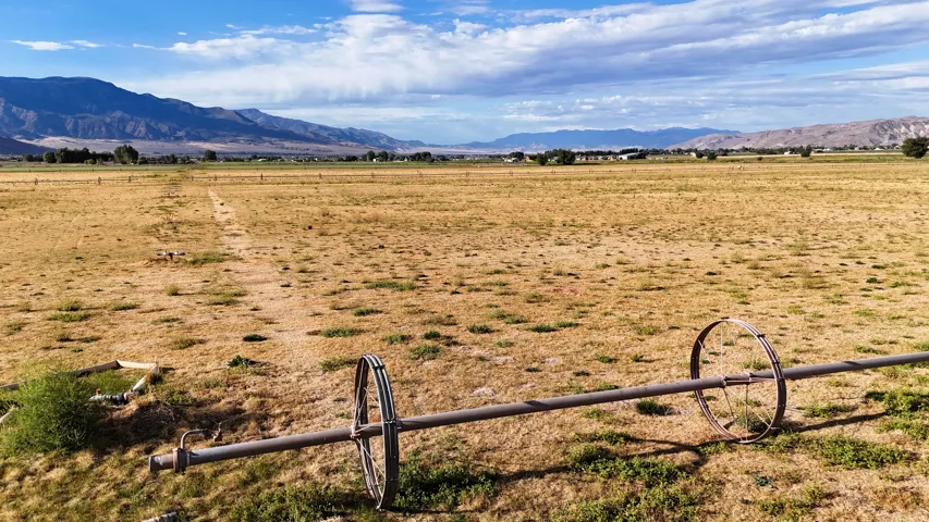 Expansive open field with distant mountain range