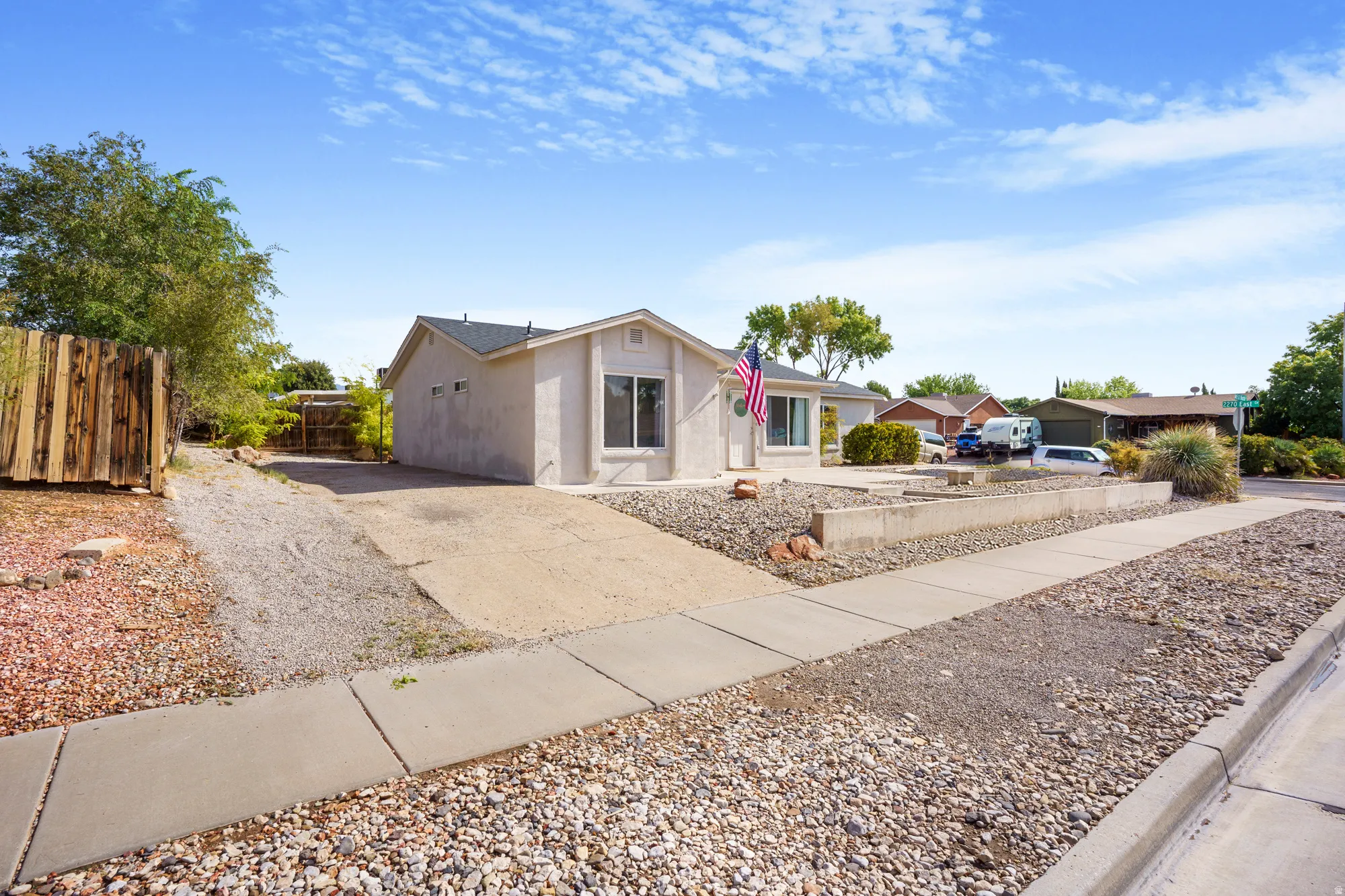 Single-story stucco exterior residence with a composition shingle roof