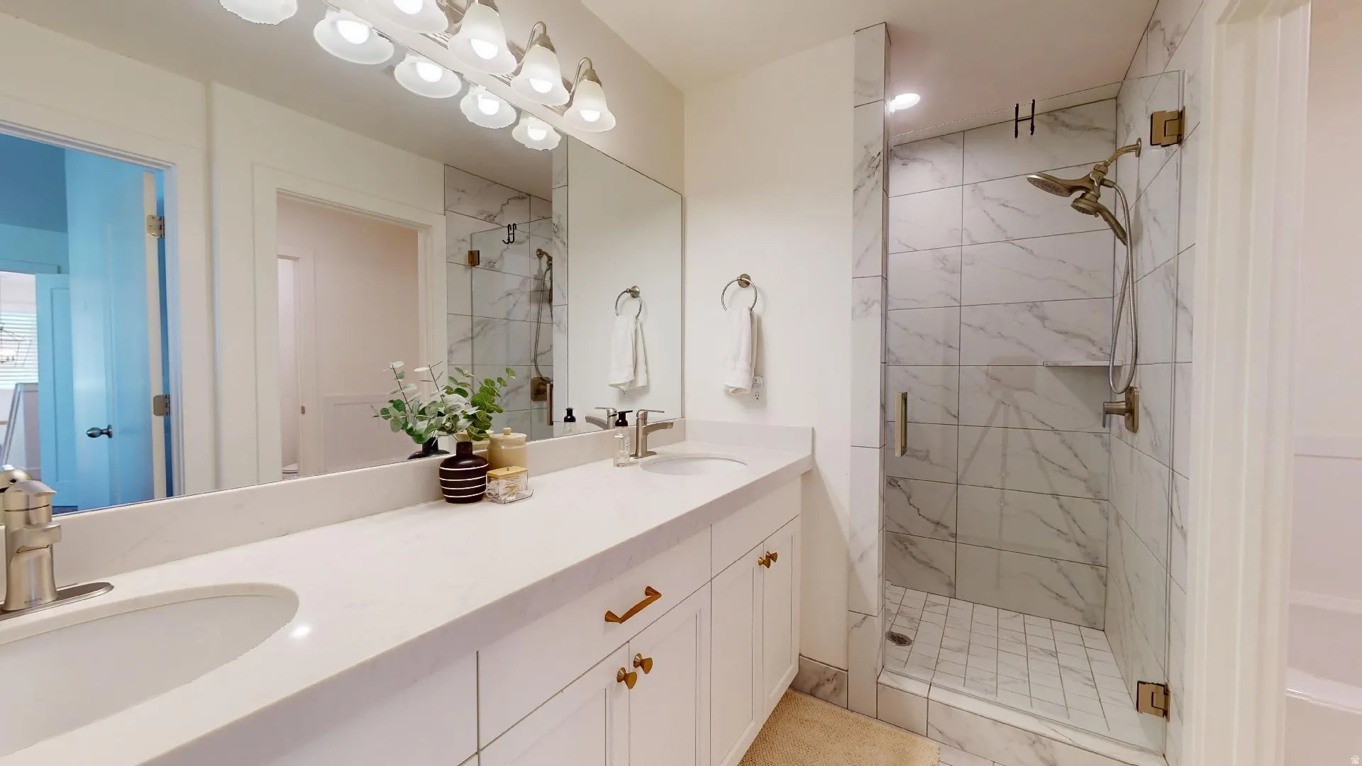 Dual vanity with undermount sinks and light-toned countertops