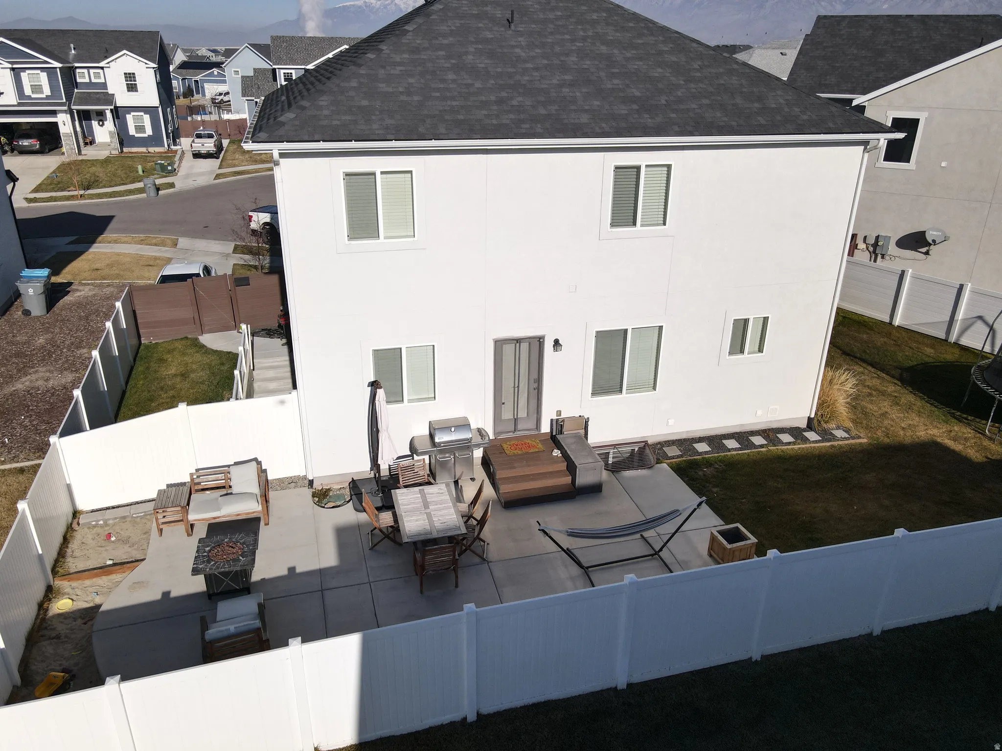 Rear facade with multiple windows and a sliding glass door