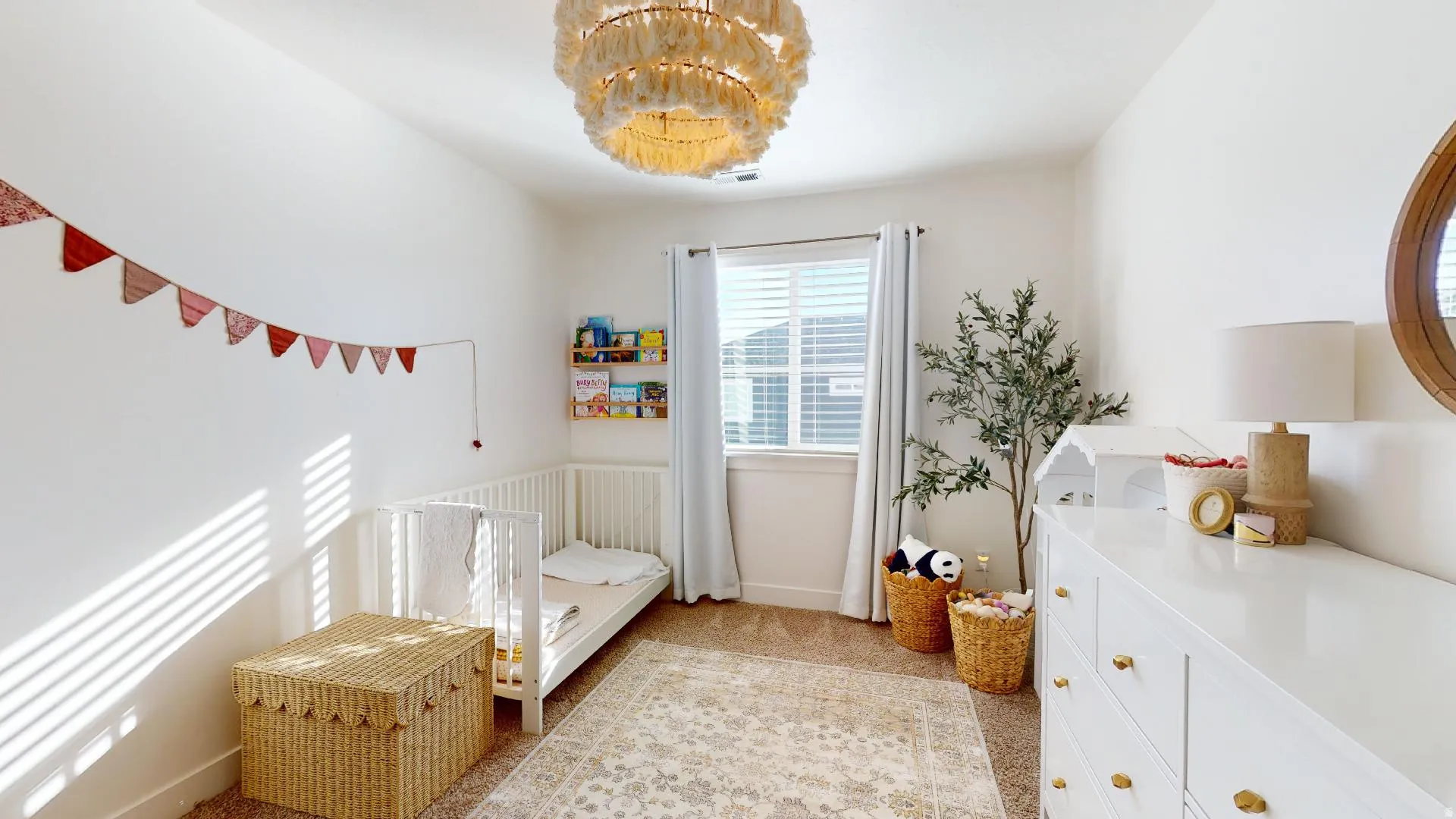 Plush carpeted flooring, a large window with blinds, and recessed lighting