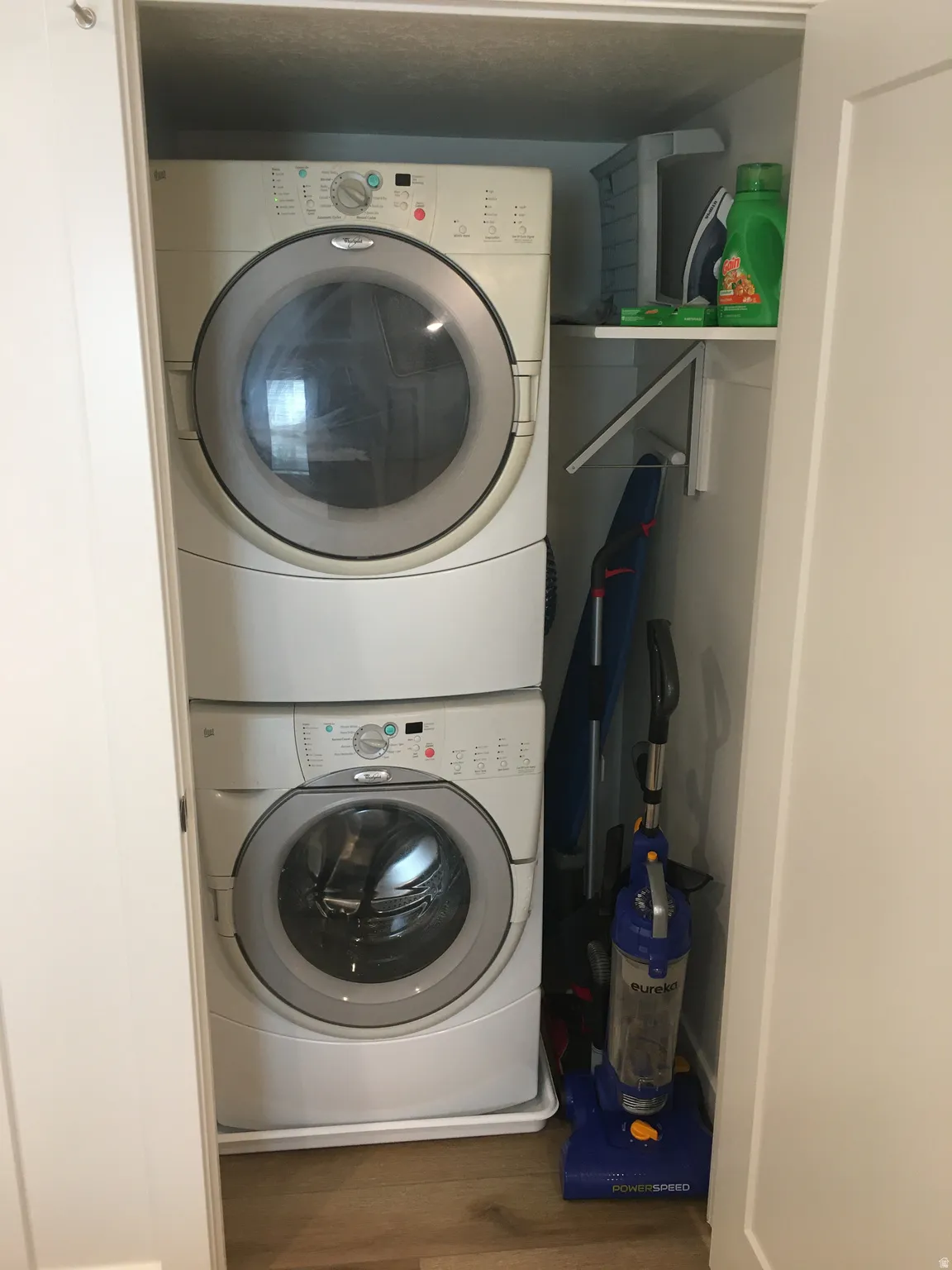 Stacked laundry appliances within a dedicated closet