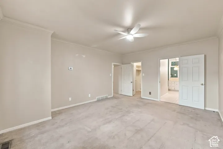 Recessed lighting, crown molding, ceiling fan, and carpeted flooring