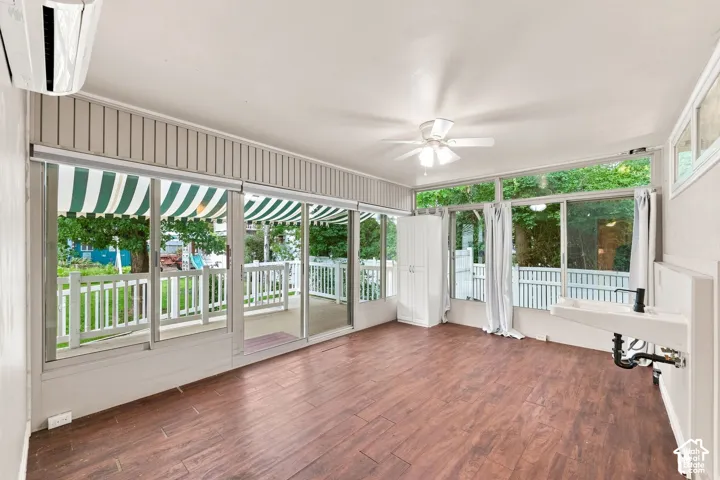 Wood-finish flooring with extensive window coverage and a built-in sink and Washer Dryer Hook-ups.