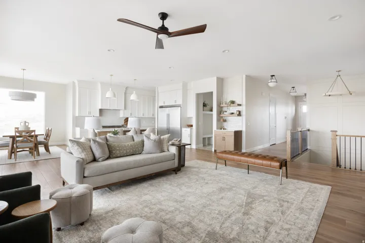 Open-concept living space featuring wood-finish flooring, recessed lighting, and a modern ceiling fan