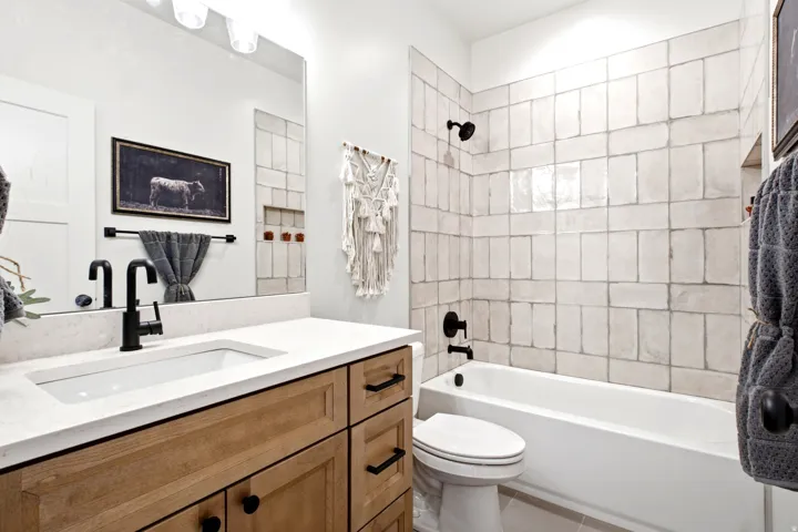 Wood-finish vanity with an undermount sink and white countertop
