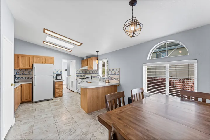 Vaulted ceiling with skylight and recessed lighting