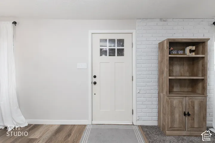 Panel-style entry door with divided light window