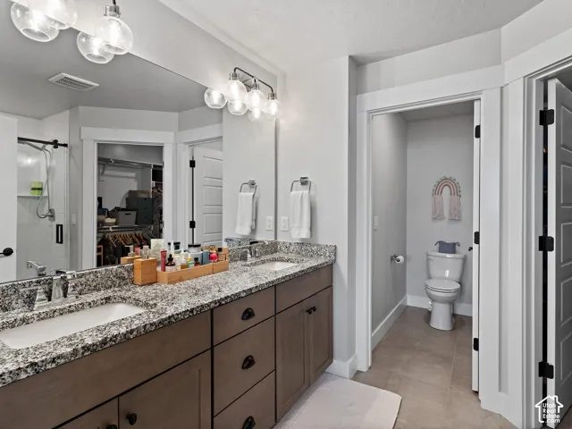 Dual vanity with granite-style countertops and undermount sinks