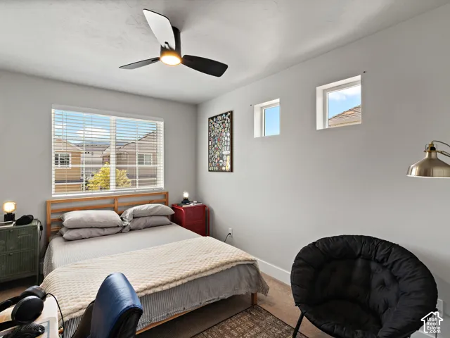 Recessed lighting, ceiling fan with integrated light, multiple windows, and light-toned wall finishes