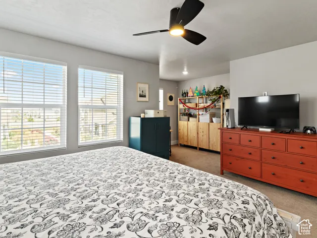 Two large windows with blinds provide natural light