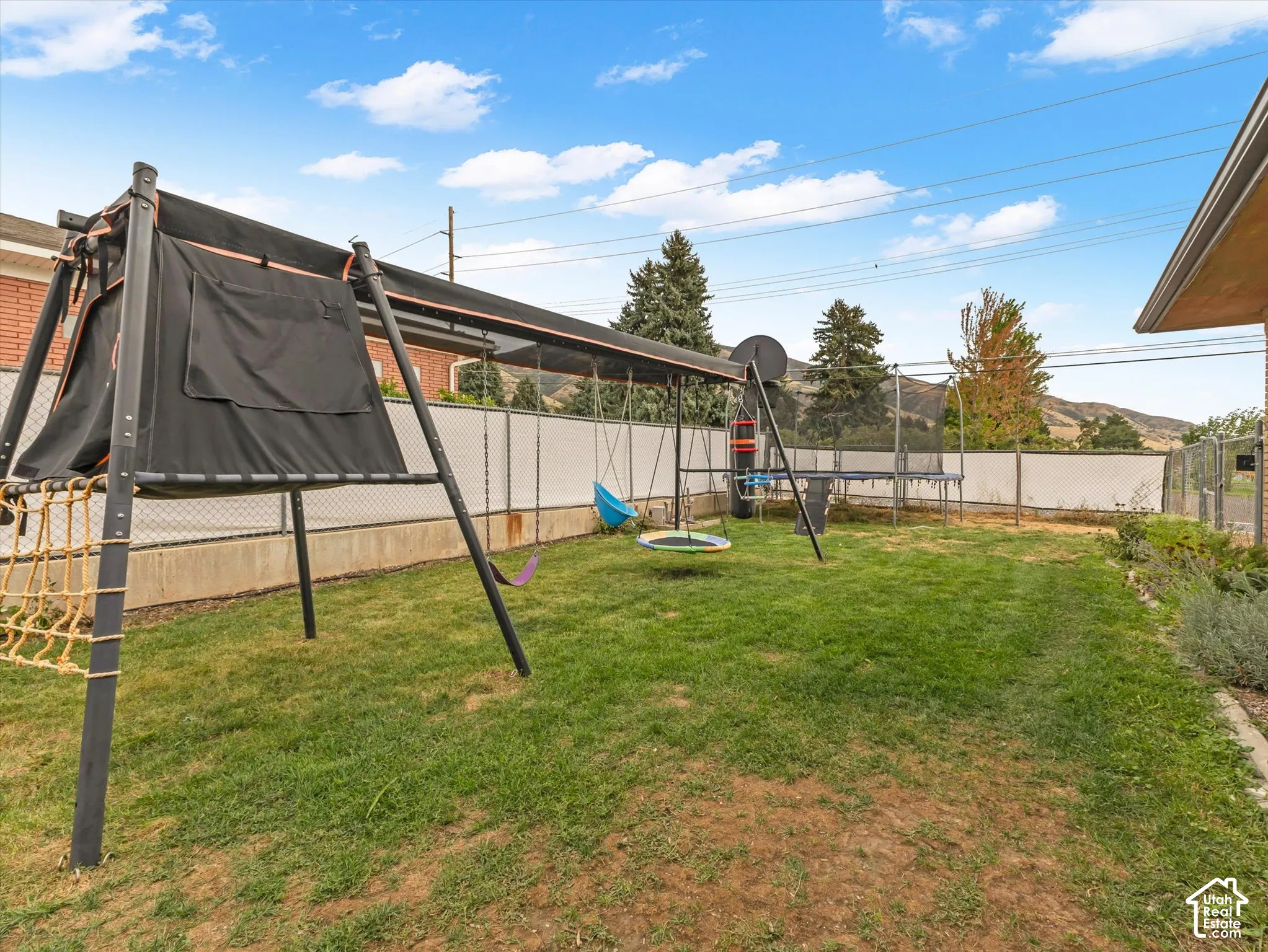 Expansive green lawn with mountain backdrop