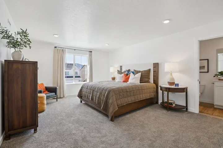 Plush carpet flooring, recessed lighting, and a window with exterior residential surroundings