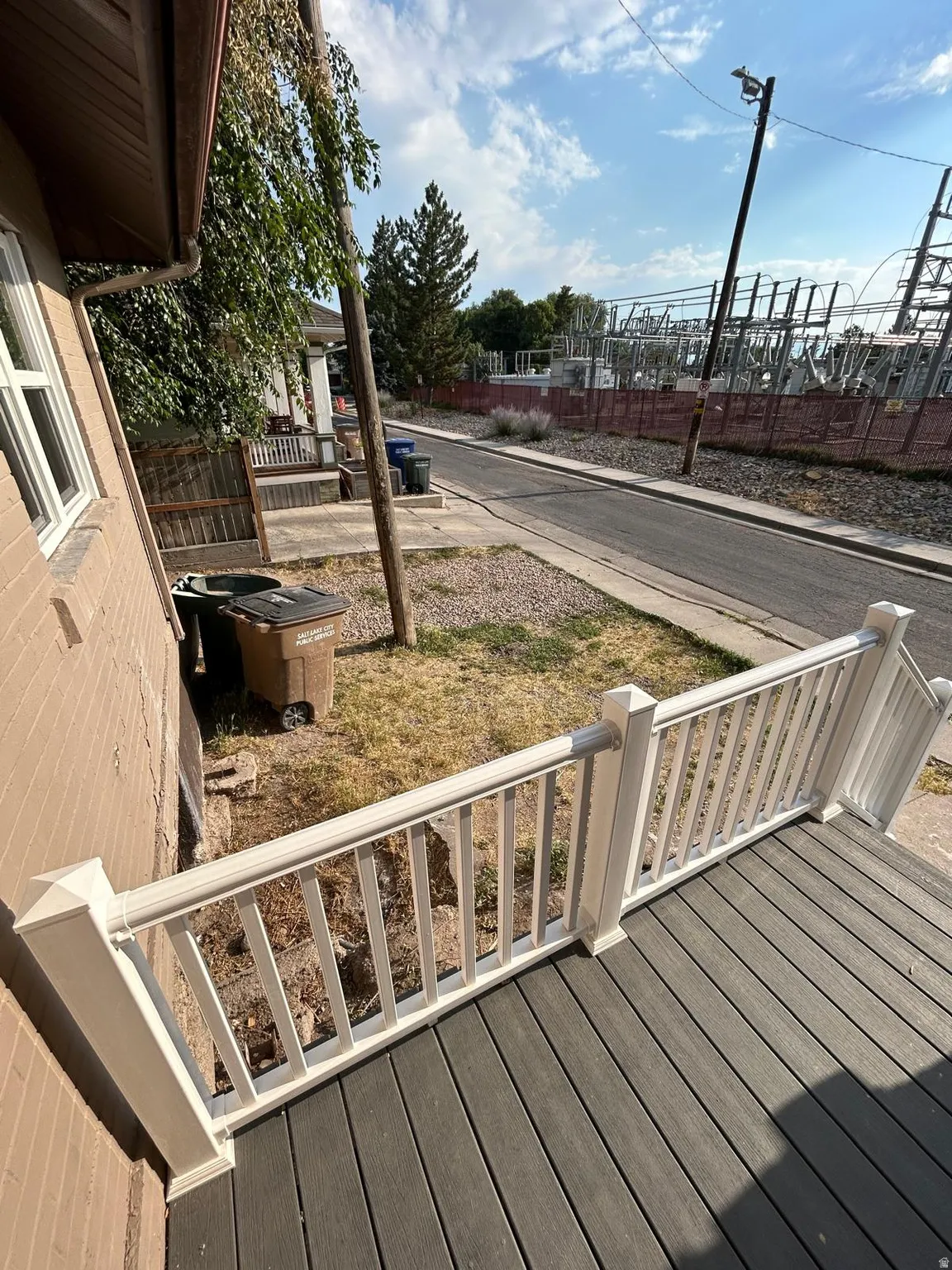 Deck with composite flooring and white railings