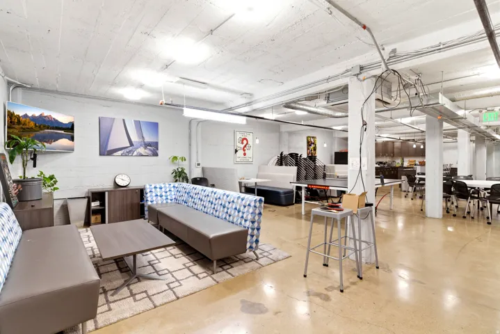 Open-concept space featuring concrete flooring, exposed ceiling systems, and recessed lighting