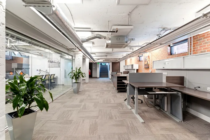 Exposed brick accents, polished concrete ceiling, and industrial-style ductwork