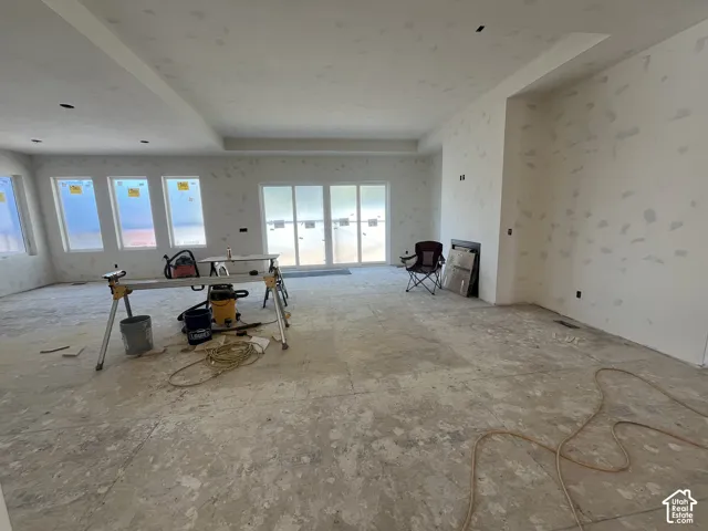 Integrated fireplace, recessed lighting, and multiple large windows