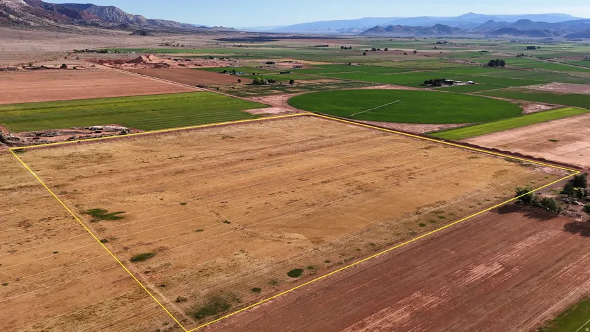 Expansive undeveloped land featuring a level topography and surrounding agricultural fields