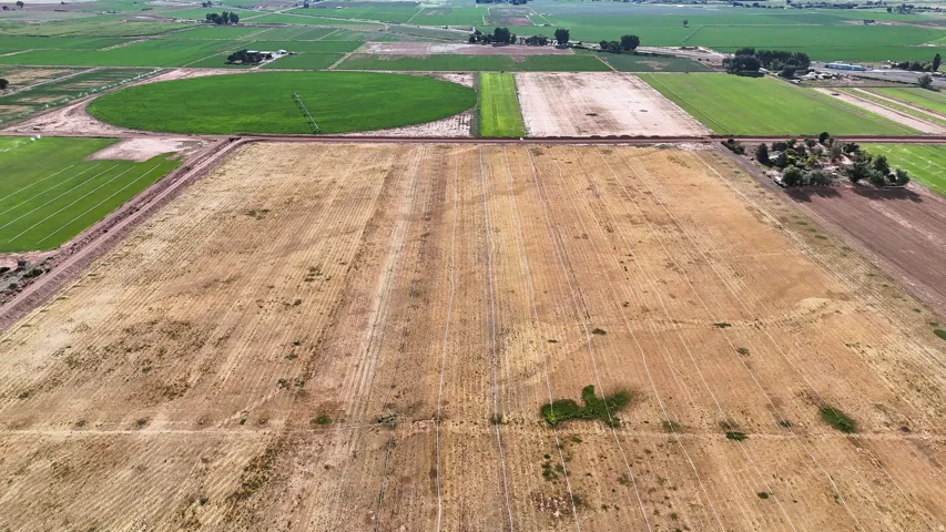 Expansive agricultural land featuring a large open field
