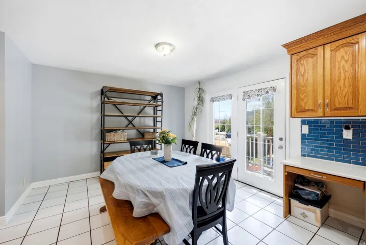 White tile flooring, light gray wall paint, and white trim