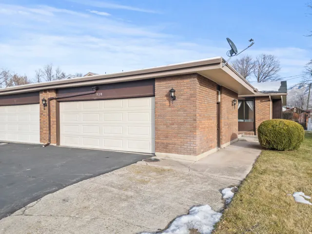 Brick exterior with multiple garage doors