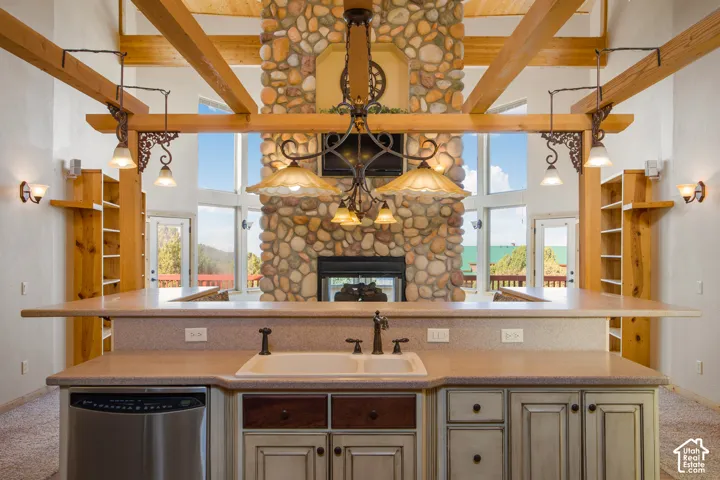 Kitchen island with an undermount double-basin sink and stainless steel dishwasher
