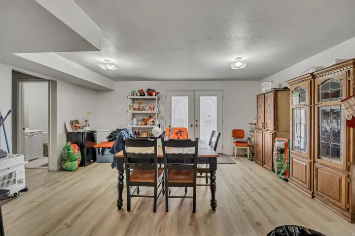 Recessed ceiling beam, wood-finish flooring, and white walls
