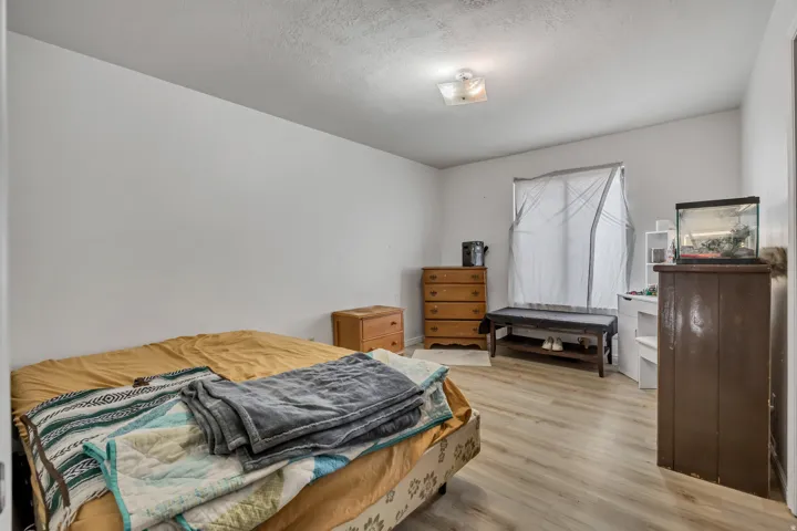 Light wood-finish flooring complements neutral wall tones