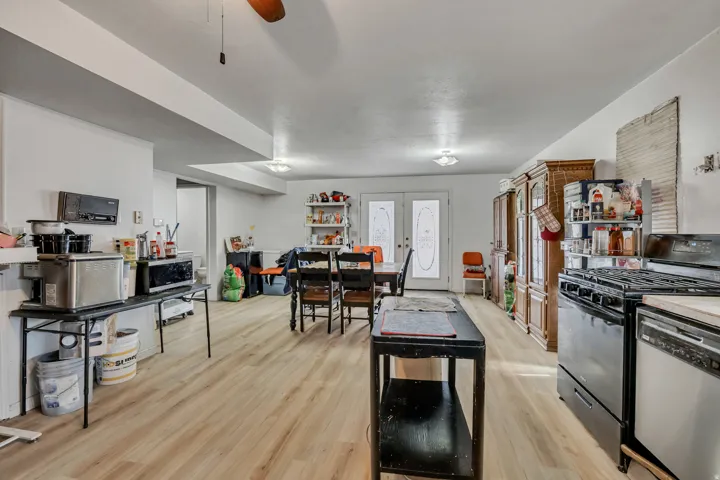 Wood-finish flooring, recessed lighting, and a neutral color palette